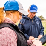 A Precision Ag Specialist, and an Agronomy Account Representative testing a customers crop.