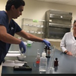 Pharmacy Tech student receiving hands on training in the lab.