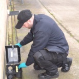 Technician setting rat trap