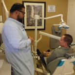 Dental Assistant engaging with one of our patients!